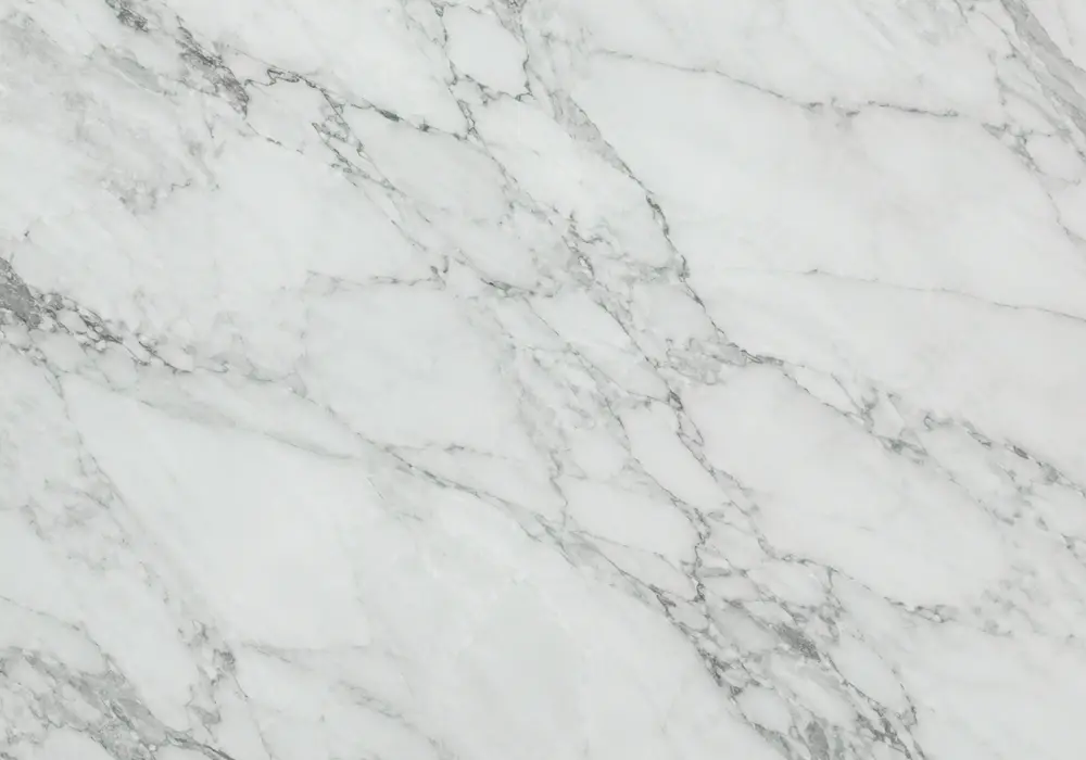 Flowing Verde Lapponia quartzite slab with emerald layers, sweeping white bands, black veins and water-like mineral depth.