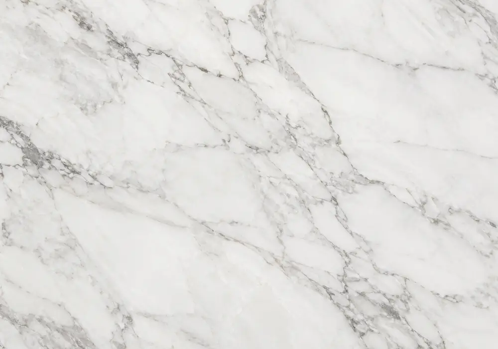 Crema Marfil marble in a luxury hotel lobby, showing natural veining, polished stone depth and refined architectural detail.