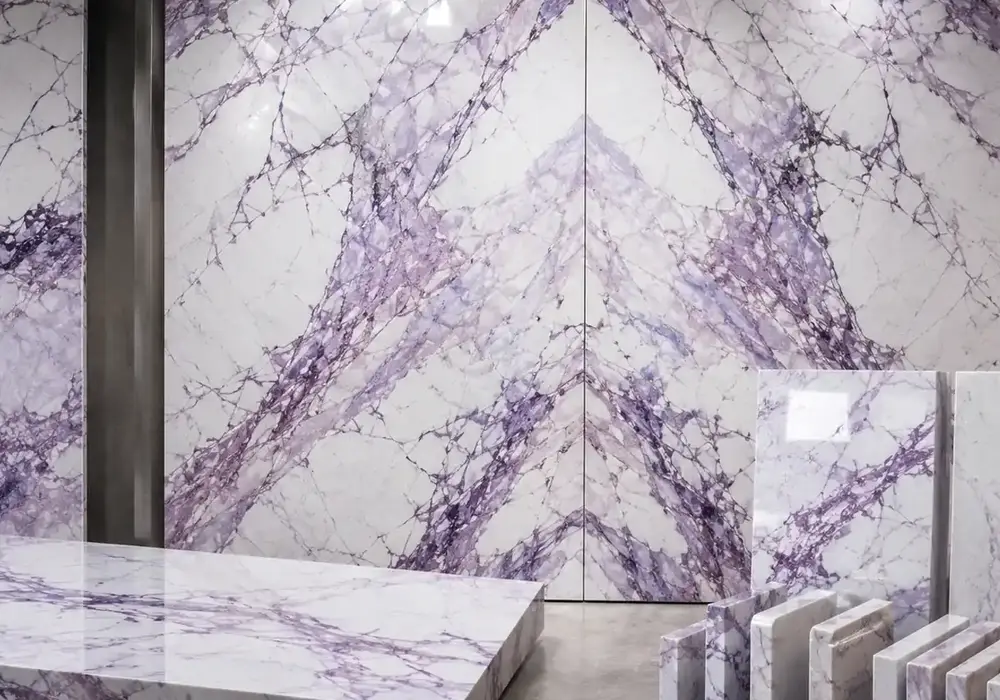 Striking Milas Lilac marble slab with a cool white field crossed by violet, plum and dense charcoal branching vein networks.