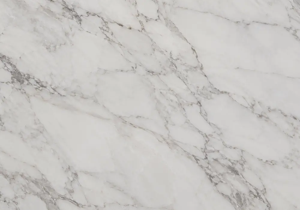 Makrana Marble bookmatched wall panel in a luxury stone gallery with mirrored veining and upright slab displays