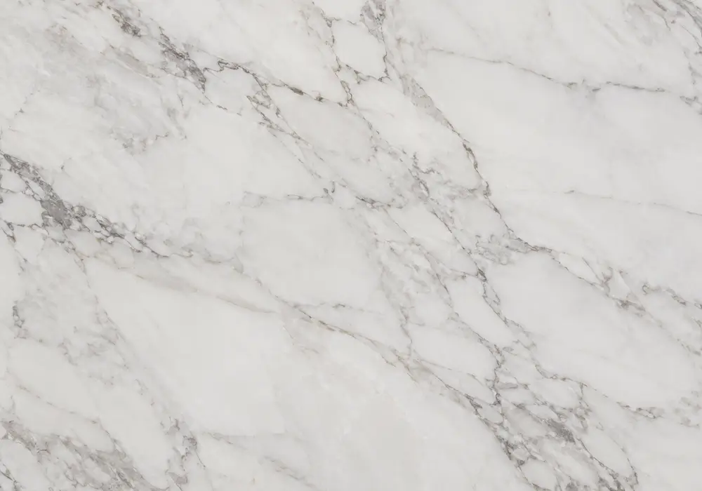 Pure White Makrana marble slab with a milky crystalline field, restrained grey-beige threads and faint mineral markings.
