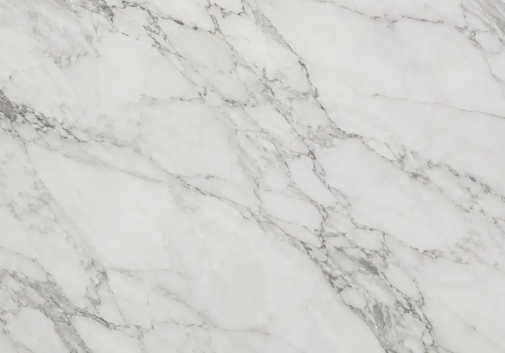 Marble Gold console tabletop in a refined stone showroom with natural slab displays and polished surfaces