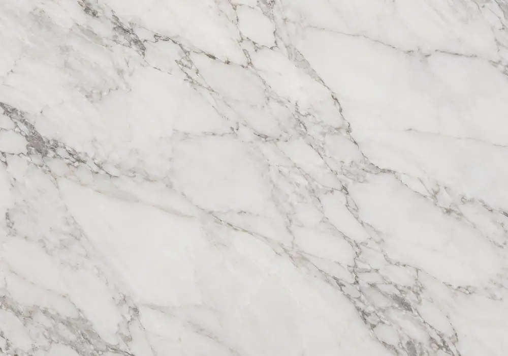 Luminous Michelangelo marble price slab with open ivory space, gentle grey-taupe ribbons, warm-gold edging and mineral halos.
