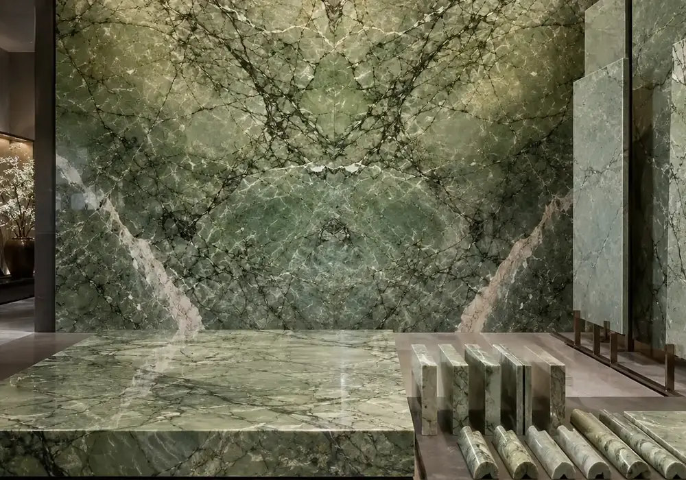 darker green movement flows through jade-toned polished panels and honed exterior samples with lot-to-lot shade variation.