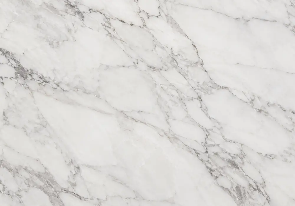 marble showroom Sharjah scene with cream Monaco-style flooring, stairs, wall panels, kitchen counter and bathroom vanity.