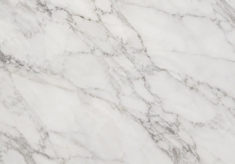 Morwad marble flooring across a floor with honed stairs and kitchen island, showing clean white with subtle beige veins.