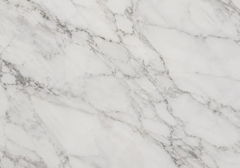 Refined Mugla White marble slab with pristine white ground, soft grey clouds, cream veins and subtle local quarry variation.