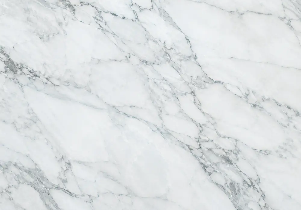 Polished blue and grey stone for Greek Ocean Blue marble, featuring flowing waves, clouded movement, plus fine mineral depth.