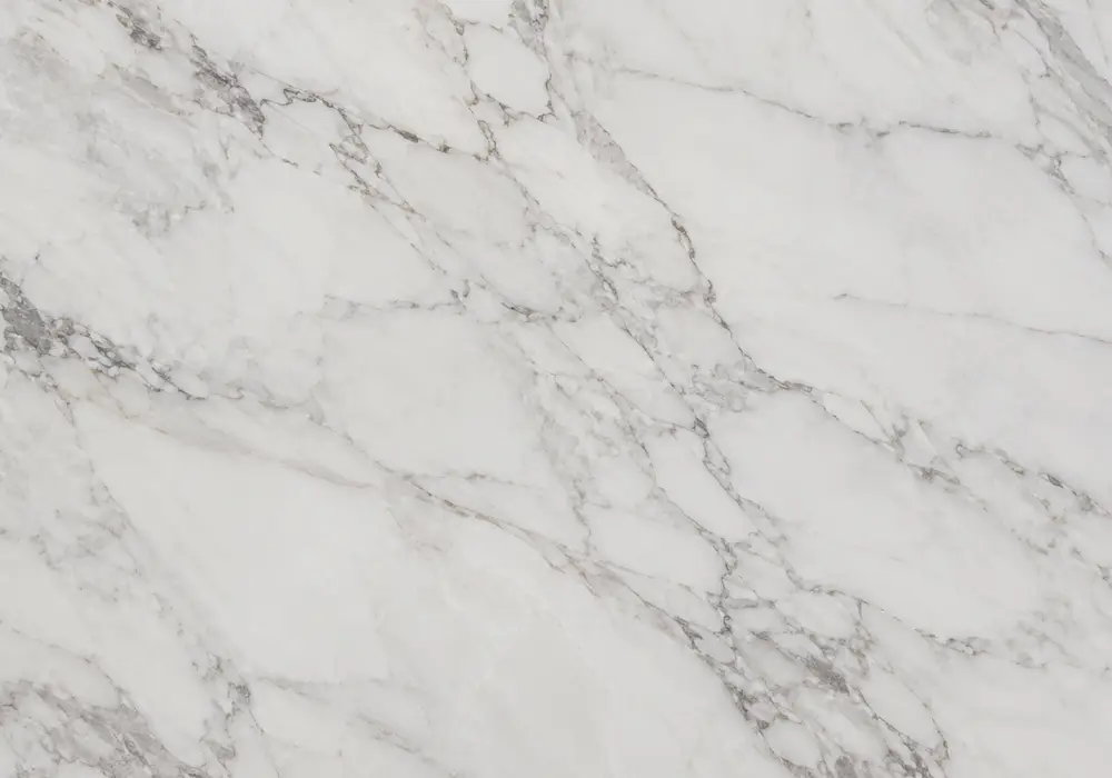 Olympian White Danby marble displayed in white and grey tones with clouded movement and fine pores, plus fine mineral depth.
