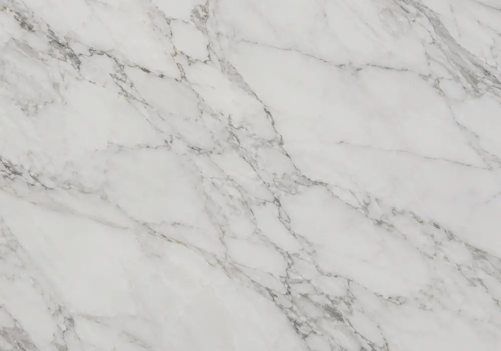 Victoria Beige trade name shown on hotel lobby flooring, wall cladding and stairs with fossils and soft golden-beige veining.