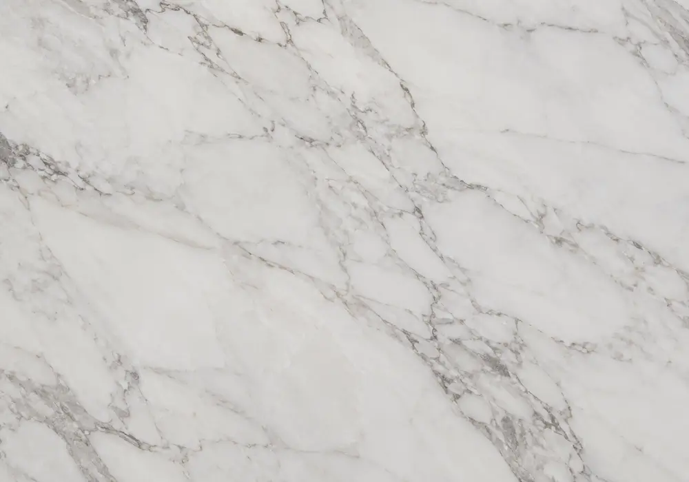 Palissandro Classico in a luxury stair hall, showing authentic veining, true stone texture and soft architectural lighting.