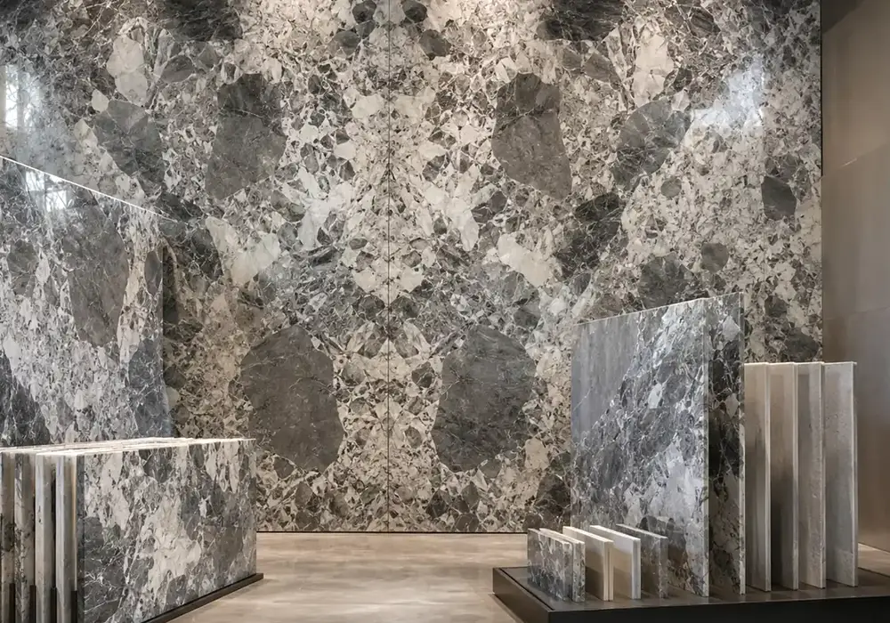 sophisticated multitone feature stone across a statement wall, flooring and a sculptural countertop, with realistic finishes.