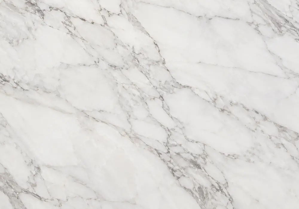 Classic Pentelic marble Parthenon slab with creamy white crystal grain, faint grey-beige lines and warm golden undertones.