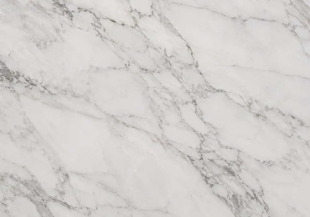 Persian Silk countertop in honed silver-grey stone with polished vanity and shower wall, showing soft fabric-like veining.