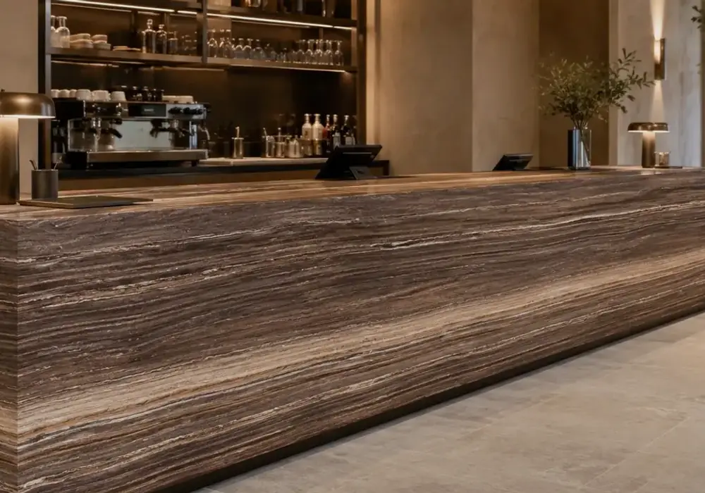 sophisticated natural feature stone across wall cladding, flooring and a stone countertop, with authentic slab variation.