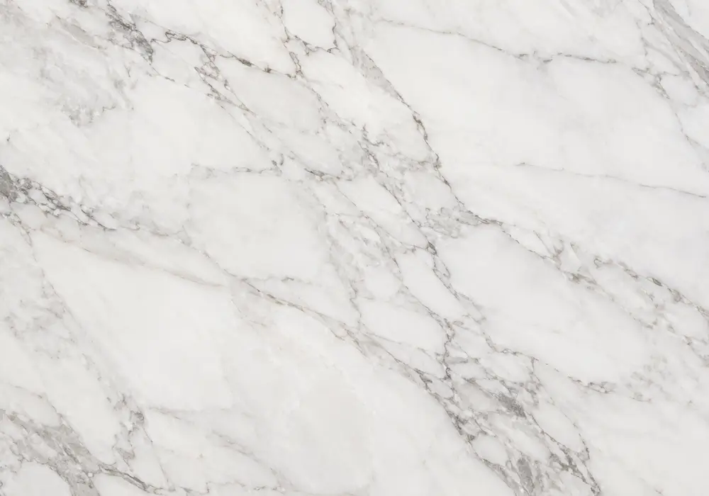Polaris White marble dining tabletop with bright snow-white stone and subtle cool-grey natural movement.
