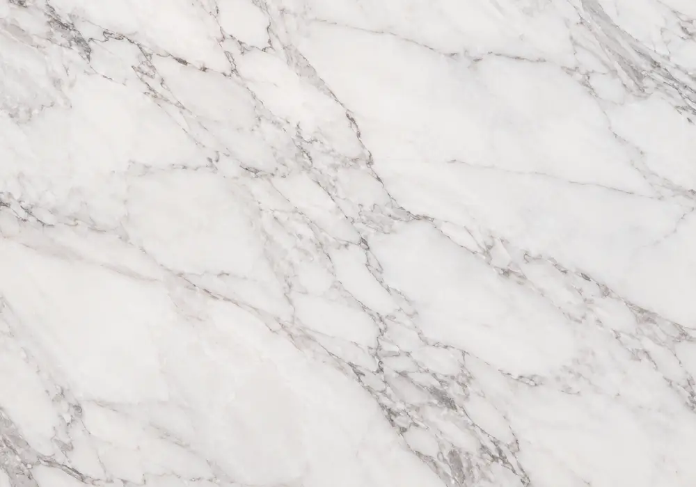 Red Marble console tabletop in a premium stone showroom with upright slabs and refined interior finishes