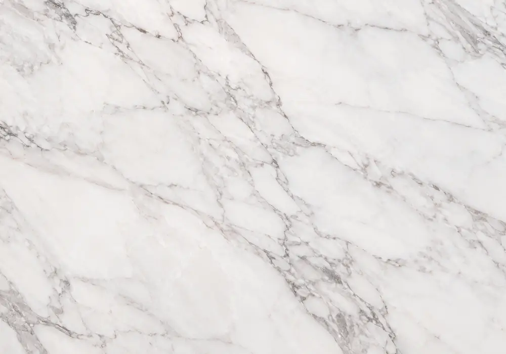 Crimson, brick and wine tones merge with pale calcite ribbons, giving burgundy natural stone a bold geological identity.