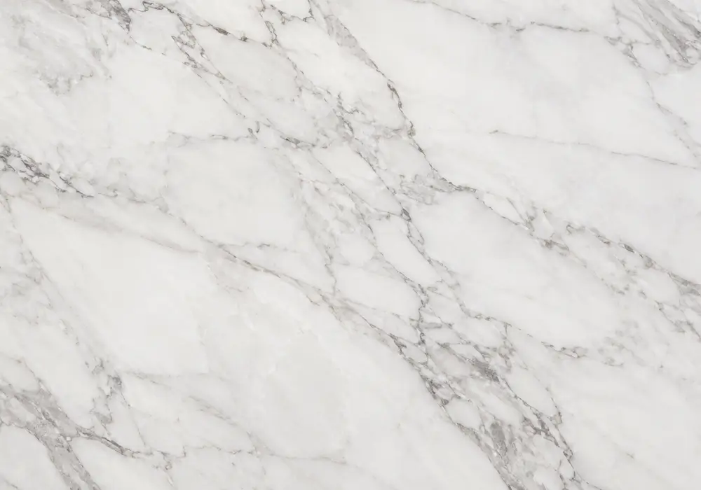 Red Alicante marble featured in a Mediterranean hotel foyer, with polished stone depth and refined architectural detailing.