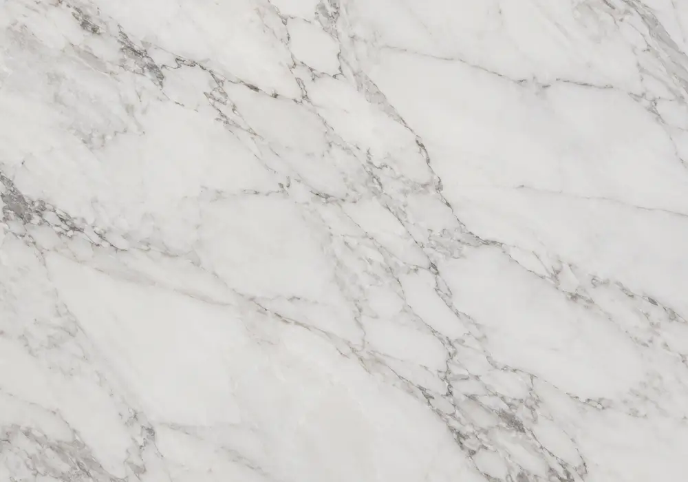 Perlino Rosa marble featured in a boutique hotel bathroom, showing natural texture, depth and refined architectural detail.
