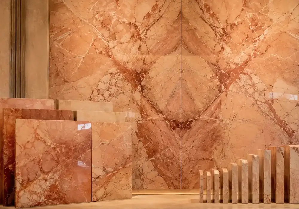 Rosa Valencia marble decorative reception wall with peach-gold stone and fine rose, cream and brown veining