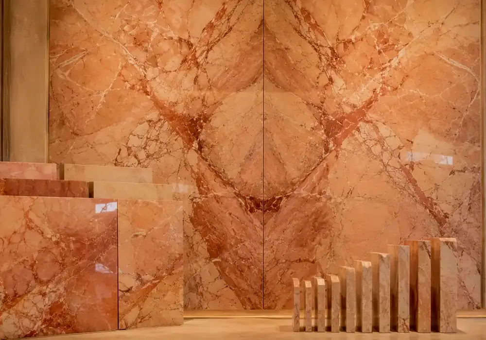 sophisticated heritage feature stone across wall cladding, flooring and a stone countertop, with authentic slab variation.