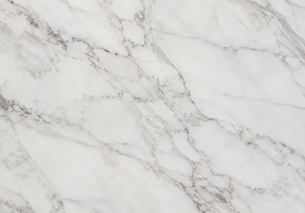 Rose Aurora marble reception wall with creamy ivory, blush pink and dusty-rose veining in a luxury interior.