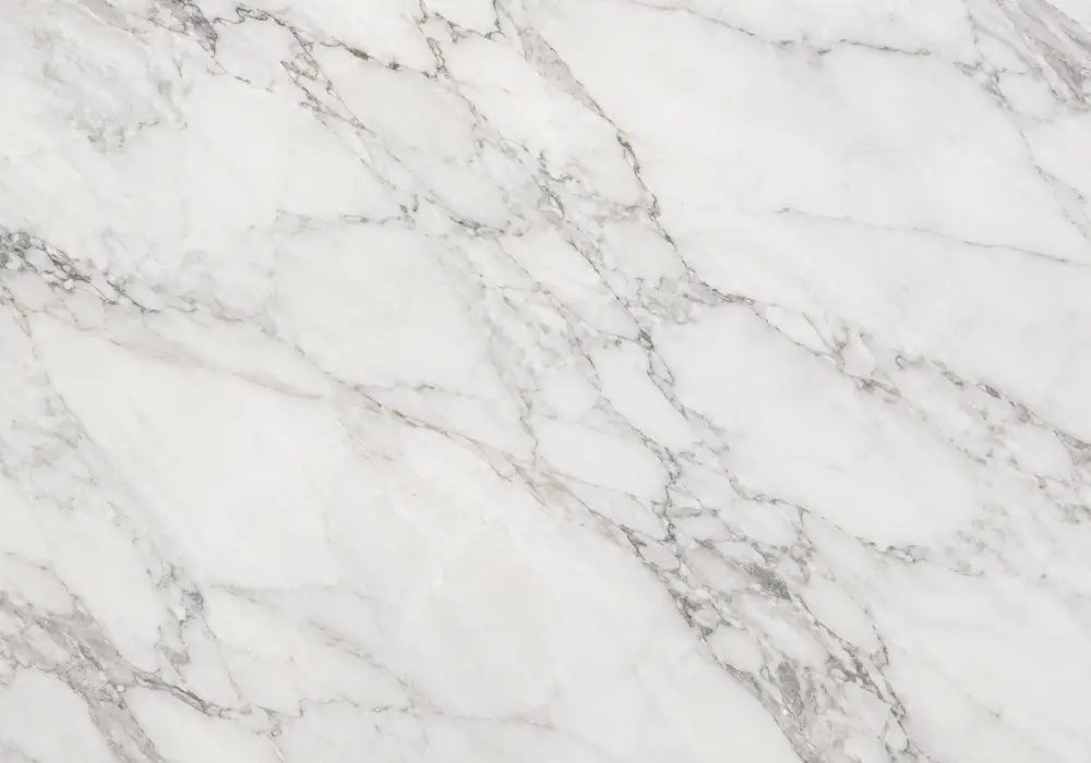 Rosso Lepanto Marble bookmatched foyer wall with wine-red stone and dramatic white calcite veining.