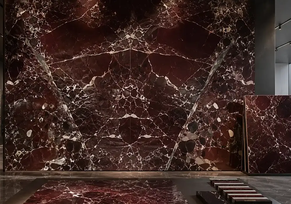 Rosso Levanto Marble slab gallery presentation with full natural panels and refined showroom lighting