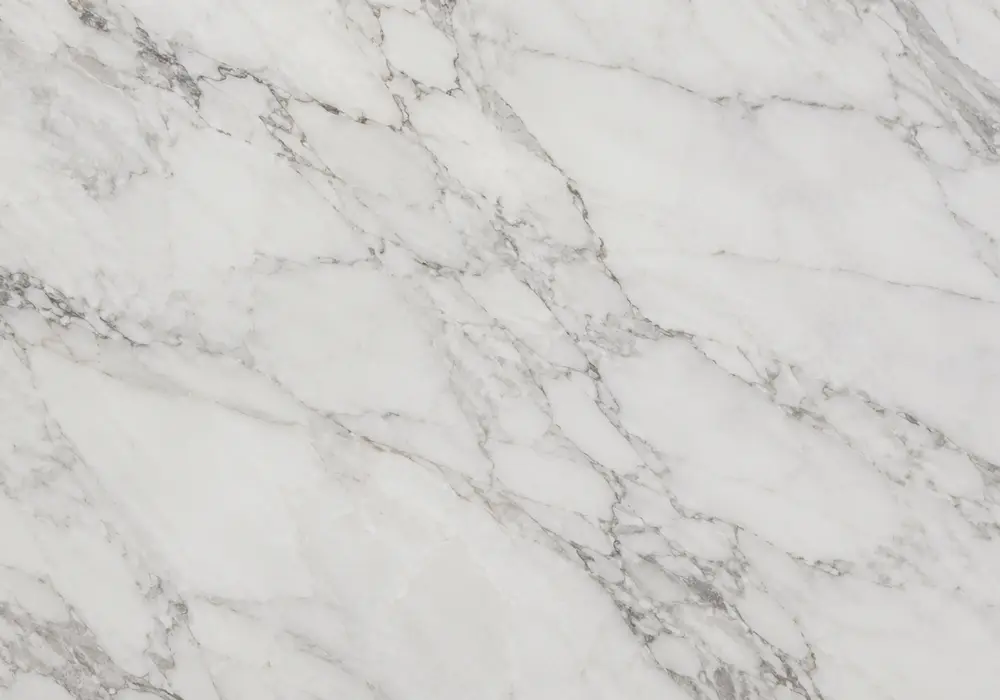 Royal Beige slabs compared in a showroom for consistent warm cream grade and tone selection