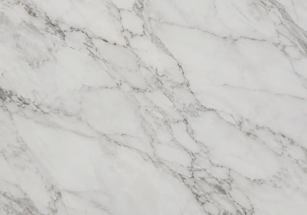 Diana Royal marble on polished kitchen island and vanity with bathroom floor, warm cream fields and fine gold-brown veins.