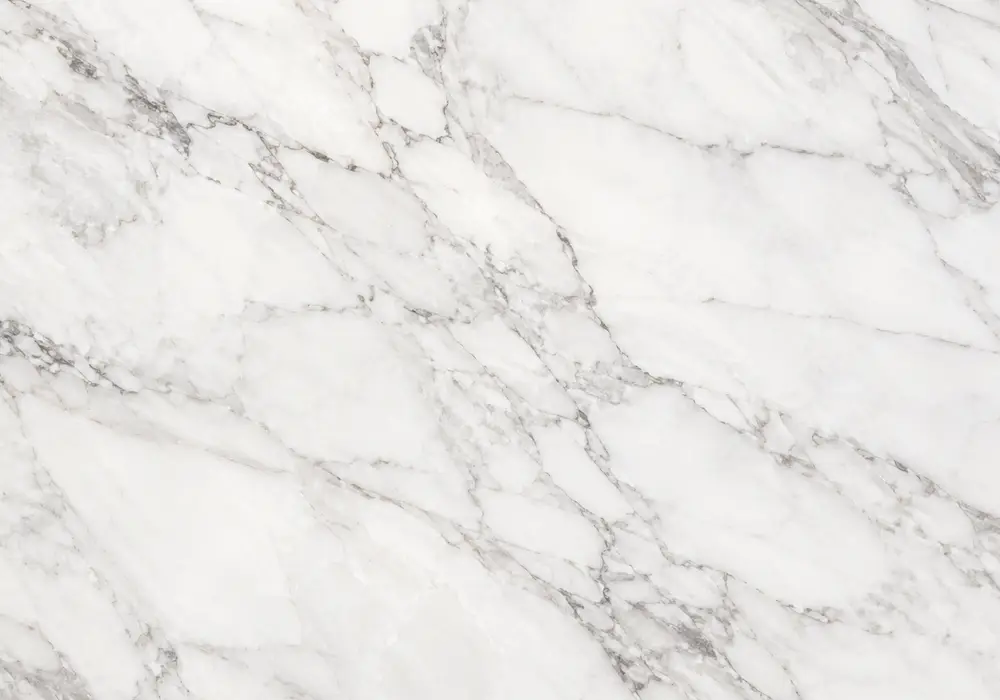 Port Laurent stone in a sophisticated lounge, showing authentic veining, refined stone texture and refined interior detail.
