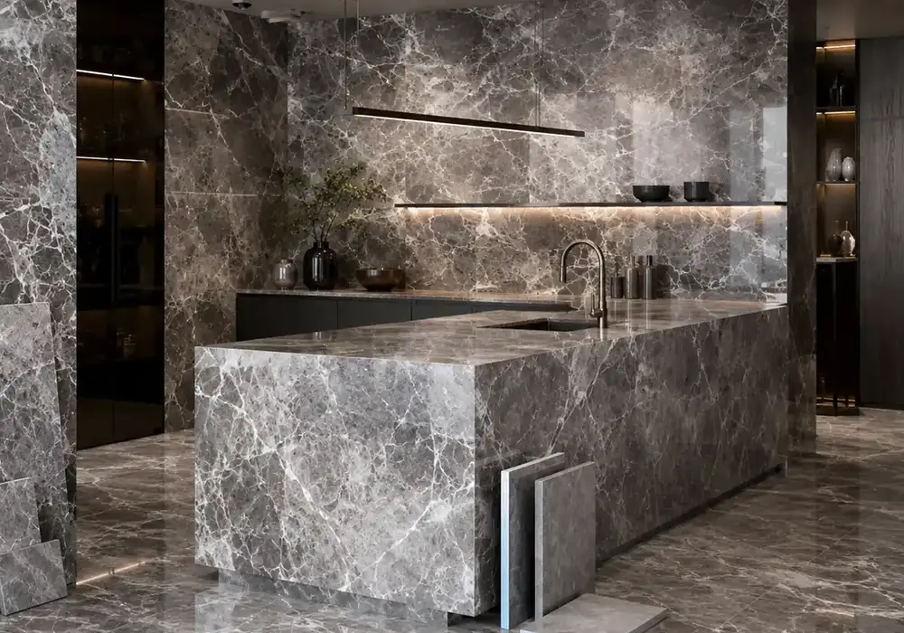 graceful contemporary feature stone across wall cladding, flooring and a stone countertop, with authentic slab variation.