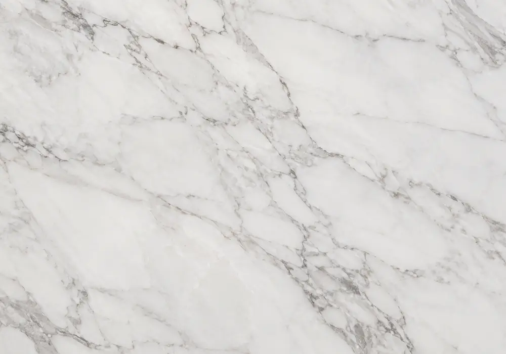 Silver River limestone on polished island and bookmatched wall with stairs, showing taupe-grey river veins and small fossils.