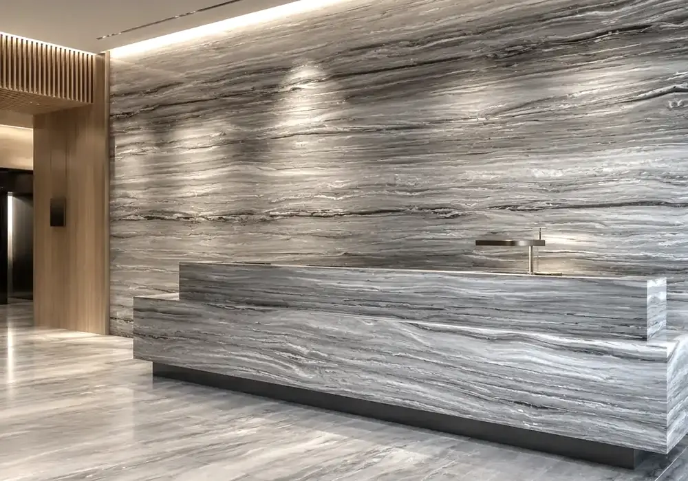 sophisticated neutral feature stone across wall cladding, flooring and a stone countertop, with authentic slab variation.