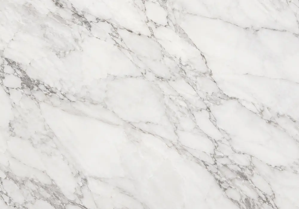 Statuario White marble price slab image with white and grey, webbed veining and branching veins, across the polished surface.