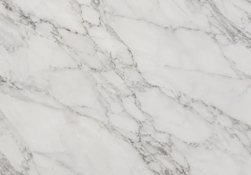Storm White UAE kitchen island and shower wall with luminous white stone, honed floor and layered grey storm-like streaks.