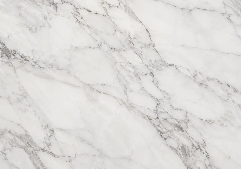 Storm White Marble luxury fireplace with luminous white stone and cloudy grey and charcoal veining.