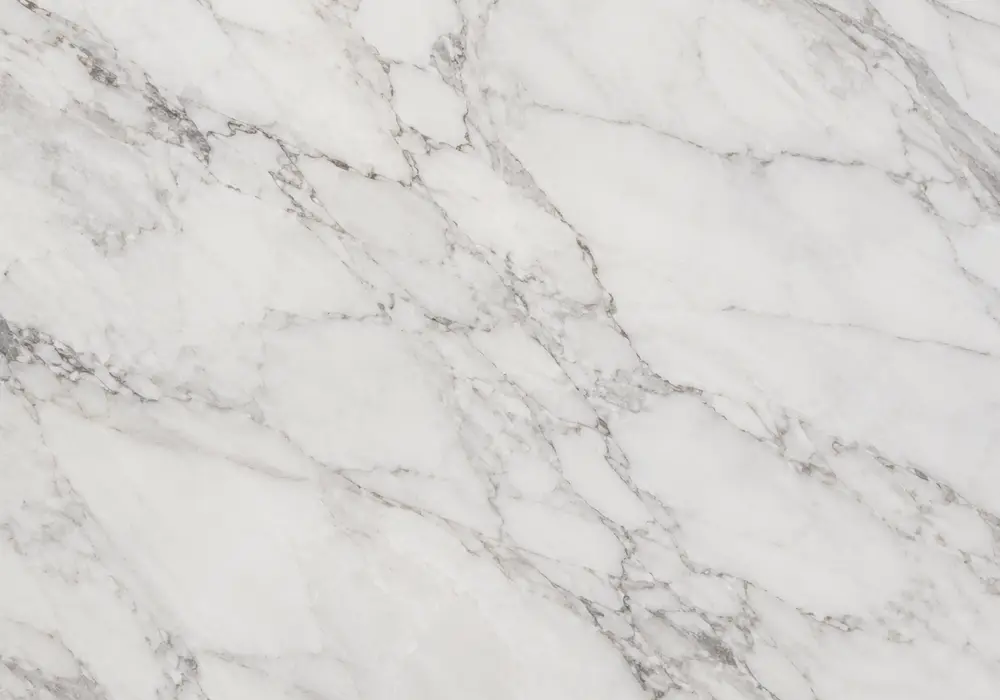 Polished Polar White marble slab with icy white depth, misty grey shadows, fine diagonal veins and stronger stormy streaks.