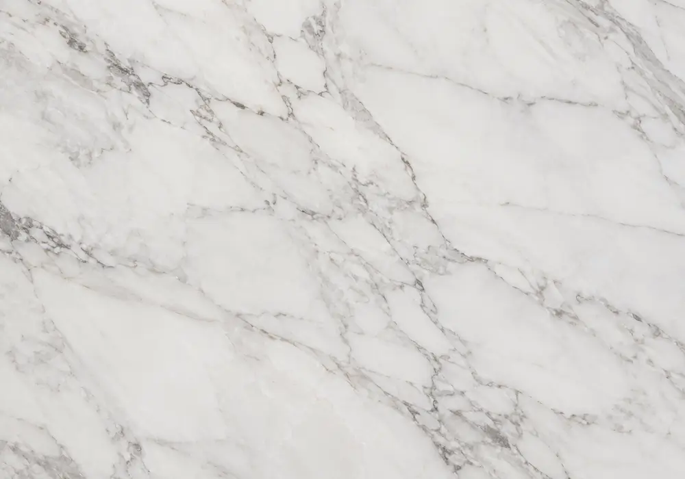 Sunny Gray marble showroom fireplace surround with warm silver-grey stone and restrained cream and beige veins.