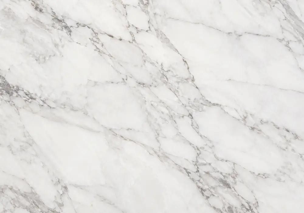 light-to-medium grey background in a commercial lobby, with natural veining, polished surfaces and refined interior detail.