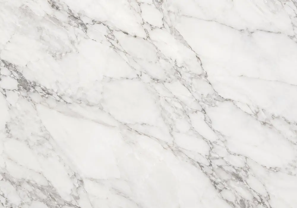 Milky cream Sunny White Marble shows faint beige veins and fossil traces, representing Pakistan Sunny White stone character.