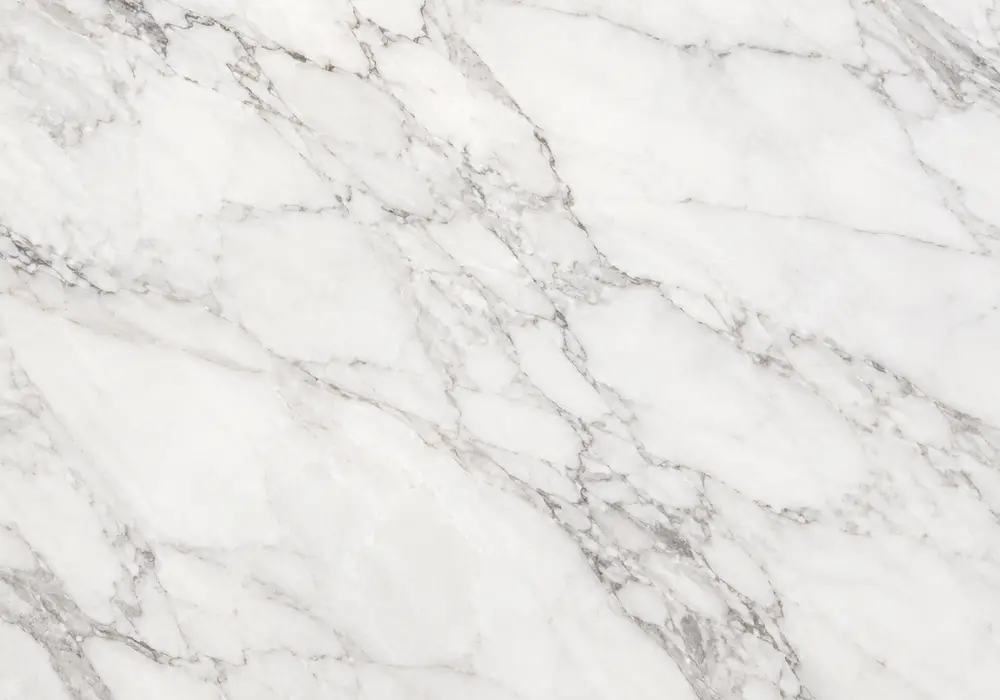 Tala Noir Marble tabletop with gold veining protected by felt pads, placemat and cutting board in a luxury interior