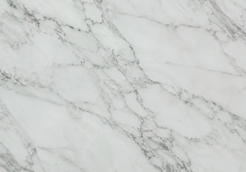 Tinos Green marble dining table with deep emerald-olive stone and bright white calcite veining.
