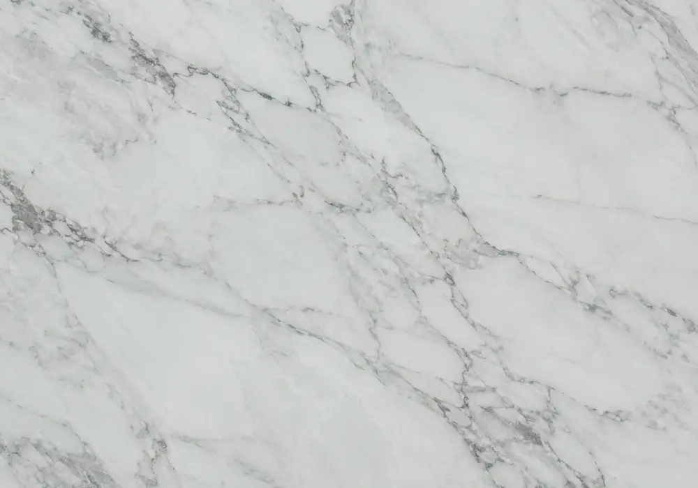 Detailed Tinos Green marble price slab with green and grey, branching veins and mineral specks, and subtle natural fissures.