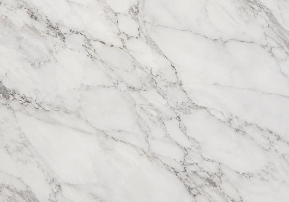 Tropical Storm Marble bookmatched feature wall with dark charcoal, blue-grey and sweeping pale veins.