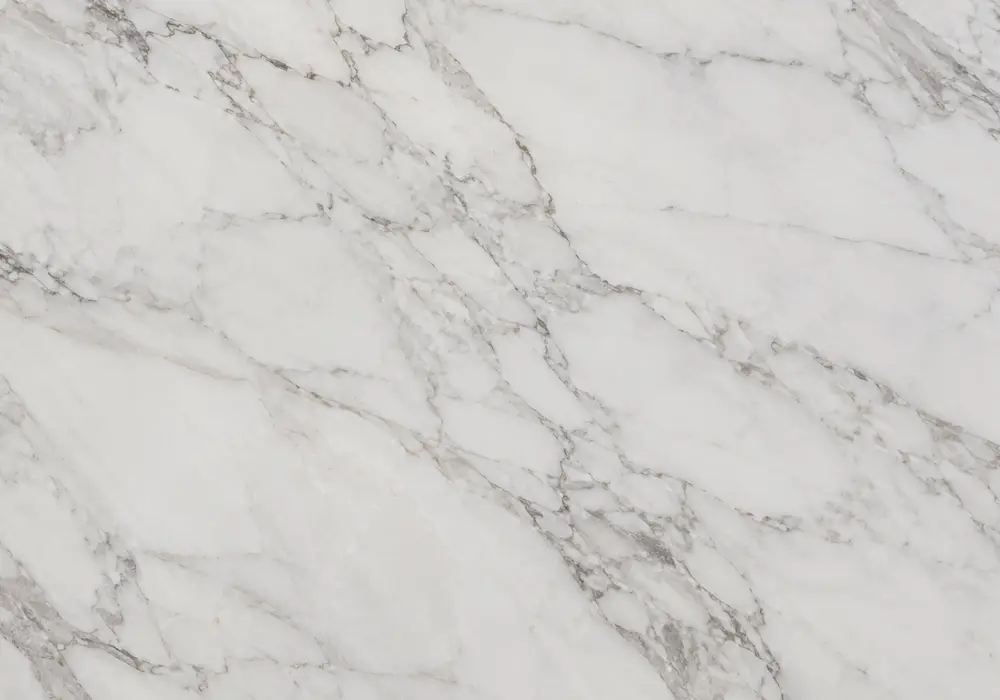 Brazilian exotic marble on bookmatched wall and island with charcoal stone, pearl ribbons and storm-like blue-grey flow.