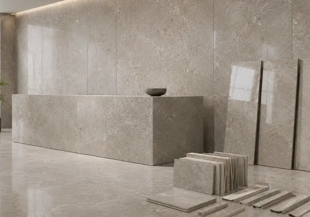 Tundra Grey Marble architectural wall panel in a luxury stone showroom with full slabs and soft gallery lighting