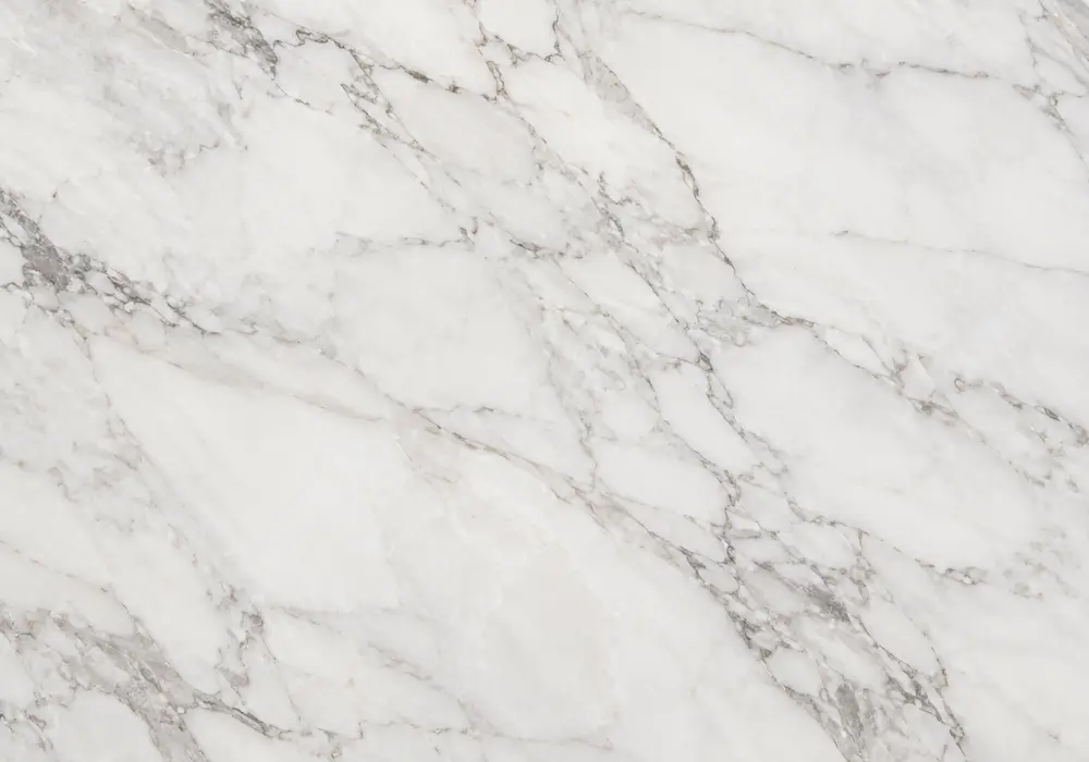 Tundra pavers and steps transition into calm grey indoor flooring, wall cladding, kitchen surface and bathroom vanity areas.