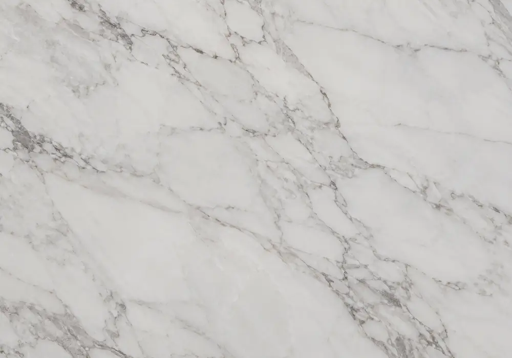Rose-gold veins drift through warm cream Valencia Marble, capturing the layered Mediterranean beauty of Rosa Valencia stone.